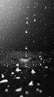 ai genererad regn droppar faller på en svart och vit yta foto