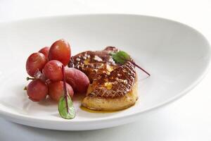 foie gras med kyld vindruvor foto