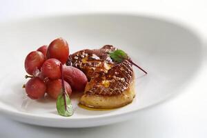 foie gras med kyld vindruvor foto