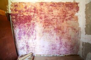 en vägg med plåster mönster grov bakgrund. texturerad bakgrund. hus reparera. foto