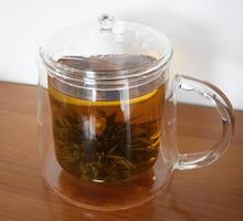 kinesisk blomma te i en te pott foto