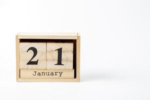 trä- kalender januari 21 på en vit bakgrund foto