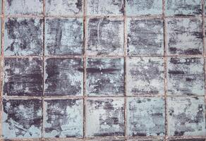 gråblå bricka vägg, abstrakt mönster mosaik- bakgrund, texturerad vägg eller golv foto