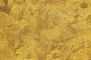 textur av gyllene dekorativ plåster eller betong. abstrakt guld grunge bakgrund. foto