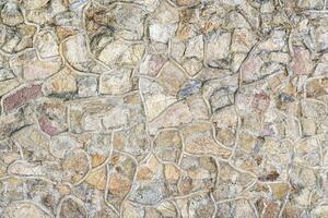 dekorativ vägg från stenar och betong. abstrakt bakgrund. foto