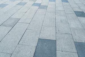de textur av en kaklade trottoar med perspektiv. foto