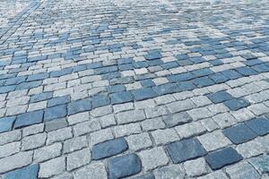 de textur av en sten gammal trottoar med en perspektiv. foto