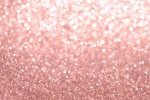 reste sig guld rosa glitter, festlig bakgrund för ny år dekor. foto