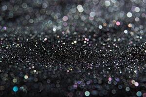 ai genererad grå bakgrund med små holografiska partiklar. sömlös regnbågsskimrande textur. foto