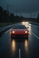 en sporter bil körning ner en våt väg på natt foto