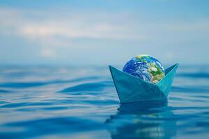 blå papper båt på de mörk blå hav vatten. begrepp för värld hav dag. foto