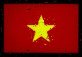 droppar vatten på vietnams flagga bakgrund. kort skärpedjup. selektiv fokusering. tonad. foto