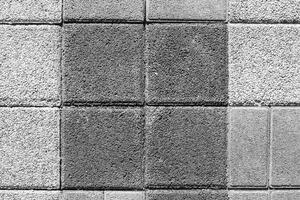 de textur av en sten monoton trottoar. topp se. abstrakt bakgrund. foto
