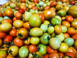 fotografi av stänga upp textur bakgrund av lugg av tomater foto