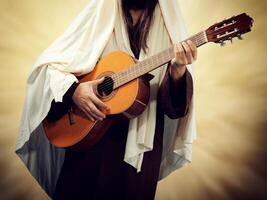 Jesus christ spelar gitarr. foto