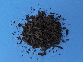 torr te löv bakgrund eller textur, svart te mönster foto