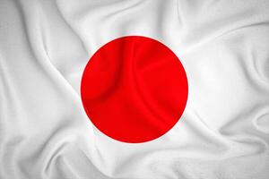 japan flagga bakgrund. japan flagga med tyg textur foto
