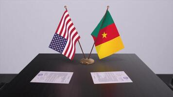 cameroon och USA på förhandlings tabell. företag och politik 3d illustration. nationell flaggor, diplomati handla. internationell avtal foto