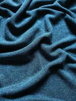 textur och bakgrund av blå sportkläder tyg fotboll t-shirt foto