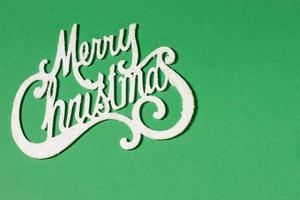 merry christmas card på grön bakgrund, kopiera utrymme foto