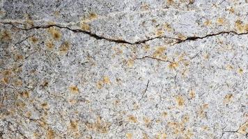 ytan av marmorn med brun nyans. detaljer av sandstensstruktur, närbild av stenyta med vinjett vid omslaget och ljuspunkt i mitten, idé för bakgrund eller bakgrund.