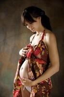 de skön ung flicka, de tredje trimester av graviditet foto
