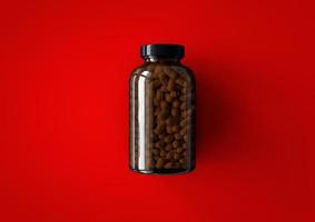 3D vitaminer flaska isolerad på röd bakgrund. lämplig för ditt designelement. foto