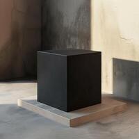 3d tolkning av en svart kub på en podium foto