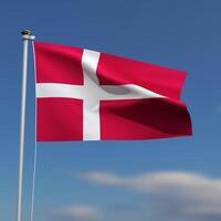Danmark flagga är vinka i främre av en blå himmel med suddig moln i de bakgrund foto