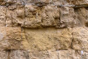 textur av ett gammal tegel vägg tillverkad av sandsten. arkeologisk utgrävningar 3 foto