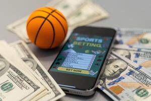 sporter vadhållning hemsida i en mobil telefon skärm, boll, pengar foto