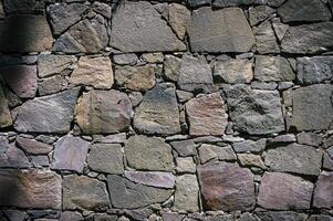 sten vägg textur bakgrund - grå sten med annorlunda sized stenar 1 foto