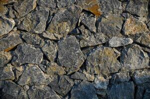 vägg av stenar som en textur 2 foto