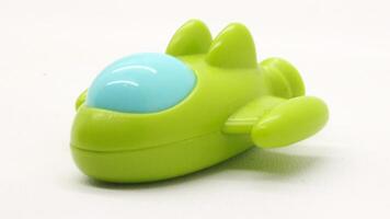 barns leksak, formad tycka om en plan i grön foto