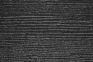 de textur av en svart artificiell planka. foto
