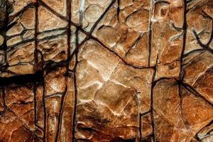 orange rock sten textur isolerade och enorm samling av granit stenar bakgrund foto