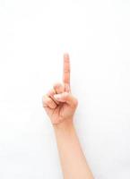 en handgest som visar ett pekfinger som pekar uppåt, vilket betyder ett eller ett utrop. samling av teckenspråket med hjälp av handgester. foto
