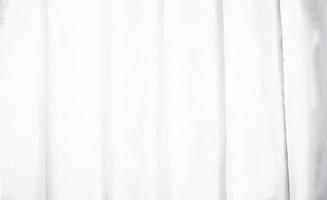 vit tygstruktur vikt ordentligt. snyggt skrynkligt vitt gardinkoncept. textil textur mockup för kreativ design förhandsgranskning. foto