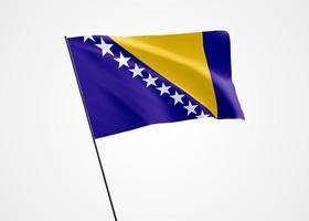 Bosnien och Hercegovinas flagga vajar högt i den vita isolerade bakgrunden. 01 mars Bosnien och Hercegovinas självständighetsdag. samling av världens nationella flagga samling av världens nationella flagga foto