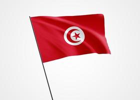 tunis flagga vajar högt i den vita isolerade bakgrunden. 20 mars Tunis självständighetsdag. samling av världens nationella flagga samling av världens nationella flagga foto