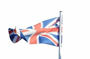 Storbritanniens flagga vajar i vinden foto