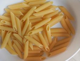 penne pasta mat bakgrund foto