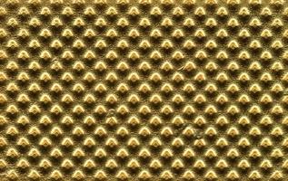 präglad guld metall textur bakgrund foto