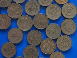ett pund gbp mynt, Storbritannien uk över blått foto
