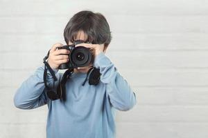 barn med kamera foto