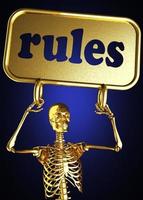 regler ord och gyllene skelett foto