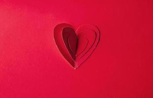 semesterkort. hjärta för alla hjärtans dag. röda hjärtan på en rygg foto