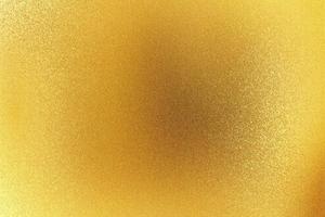 glänsande grov guld metallisk panel, abstrakt textur bakgrund foto