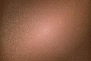 borstad mörk brun metallvägg, abstrakt textur bakgrund foto