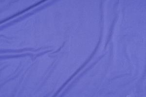 textur av blå ventilerad sporttröja, skjorta bakgrund foto